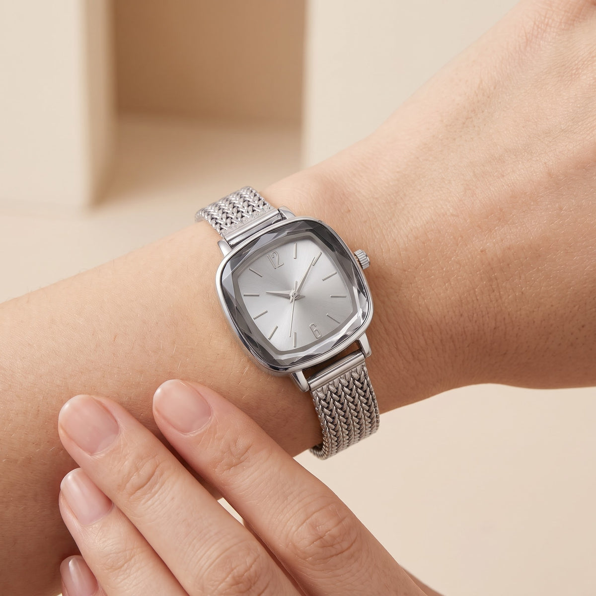 Reloj tejido plateado