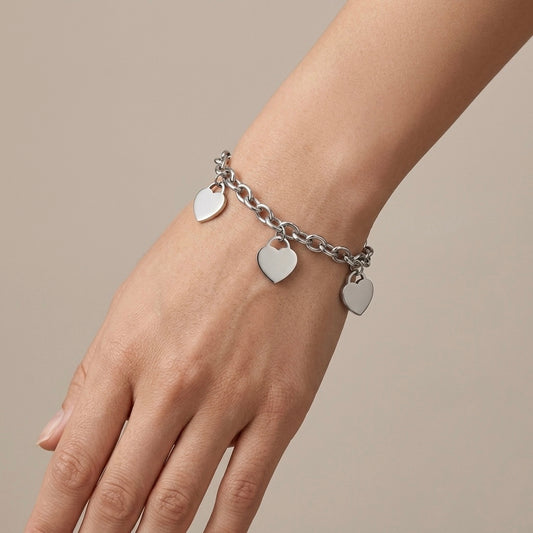 Pulsera corazones plateada